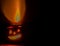 Lit Jack-O-Lantern casting reddish glow
