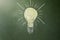 Lit lightbulb drawn on a chalkboard, horizontal