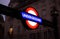 Lit up sign at the entrance of a London metro, tube, or underground station