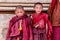 LITANG and GANZI, CHINA - MAY 02, 2016 : Unidentified two little boys smiling of buddhist novice monks are praying in Boudhanath m