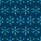 Lite blue snowflakes on blue background.