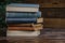 Literary composition stack of books over wooden table for education