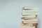 Literature for study: Stack of books; grey background