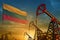 Lithuania oil industry concept. Industrial illustration - Lithuania flag and oil wells against the blue and yellow sunset sky