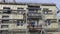 LITHUANIA, PANEVEZYS DISTRICT â€“ APRIL 17, 2014: workers fixing thermal insulation material rock wool on house wall, 2014