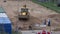 LITHUANIA, VILNIUS â€“ MAY 29: street road work place with excavator digger and workers, May 29, 2014