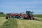 Lithuanian farmer prepare hay rows