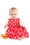 Litle baby girl with red dress, playing with toys, isolated