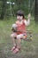 Litle cute girl sitting on swing.