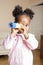 Litle cute sweet african-american girl playing happy with toys at home, lifestyle children concept