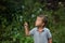 Litlle boy playing with bubble outdoor at evening