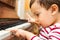 Litlle boy playing the piano