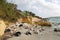 Litter and old tires on the sea shore