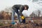 Litter picking. Woman volunteer cleaning up the trash in park. Picking up garbage outdoors. Ecology and environment