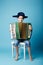 Little accordion player on blue background