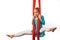 Little acrobat girl doing splits in the air