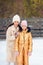 Little adorable girl with her mother skating on ice-rink