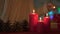 Little adorable girl lighting candles on Christmas eve, belief in happy future