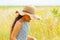 little adorable girl with long hair in the field enjoying the summer