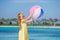 Little adorable girl playing with air ball outdoor on vacation