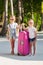 Little adorable girls with luggage during summer