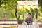 Little African-American boy at lemonade stand in park