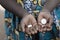 Little African Girl Holding Medicine Pills in Hands