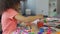 Little Afro-American girl practicing painting at kindergarten, leisure activity