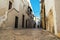 Little alley in the medieval center of the white village of Locorotondo