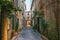 Little alley in the medieval village of Antibes in a sunny winter day