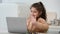 Little Arabic Girl Waving Hello To Laptop In Modern Kitchen