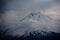 Little Ararat is covered in snow. Clouds over Mount Ararat