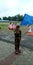 Little army solider scating with flag holding