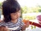 Little asia girl wakes up on the morning. She eating toast with strawberry jam. little asia girl has happy and good healthy when t