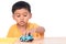 Little asian boy child kid preschooler playing with blue ca