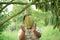 A little Asian boy in a durian garden. Sweet tropical fruit The king of tropical fruits in Thailand