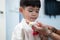 Little asian boy Giving a jasmine garland to mother On Thailand\\\'s National Mother\\\'s Day