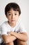 Little asian boy portrait sitting with small smile