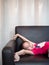 Little asian child girl kid stretch oneself on the sofa