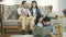 Little asian children sitting on carpet reading book