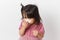 Little asian girl holding a tissue and blow her nose. Kid with cold rhinitis. virus and infection. Coronavirus symptom