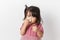 Little asian girl holding a tissue and blow her nose. Kid with cold rhinitis. virus and infection. Coronavirus symptom