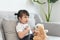 Little asian girl play with baby doll toy.Little asian girl hold stethoscope in hand and check baby doll toy