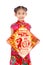 Little asian girl showing Chinese New Year Greetings