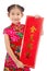 Little asian girl showing Chinese New Year Greetings