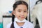 Little Asian girl in Thai student uniform wearing virus protective flu mask, Health care concept