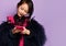 Little asian korean girl kid talking on mobile cell phone texting surprised thinking using new popular red gadget