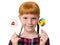 Little attractive redheaded girl with freckles holding colorful candy