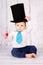 Little baby boy with big top hat