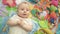 Little baby boy on colorful carpet. Portrait of infant relaxing on mat